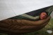 Tad Fin Paavola pokes his head from his hammock one morning during his thru-hike of the Appalachian Trail