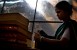 Gudi polishes a leather book in the factory where she works in New Delhi India