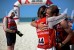 Adventure racers embrace on the beach at the Corniche in Abu Dhabi after finishing the Abu Dhabi Adventure Challenge, a race including trail running, mountain biking and sea kayaking.