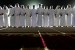 Men stand in line and dance a traditional dance during a mass wedding in Liwa, United Arab Emirates.